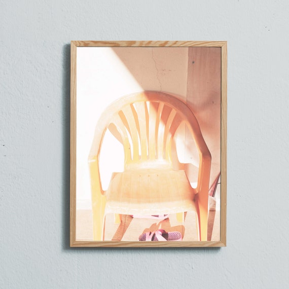 Limited edition photography art print of a yellow garden chair in the sunshine. Printed on matte paper of fine art quality.