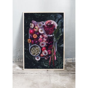 May include: A white plate filled with a variety of fresh fruit, including red cherries, sliced peaches, plums, and red raspberries. The fruit is arranged in a colorful and appetizing display.