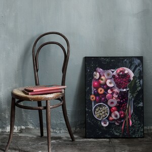 May include: A framed print of a still life featuring a variety of fresh fruit, including peaches, plums, cherries, and raspberries, arranged on a white plate with green leaves and rhubarb stalks.