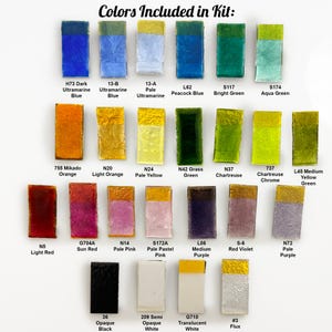 May include: A collection of watercolor paint colors in rectangular blocks, each labeled with a color name. Colors include blues, greens, oranges, yellows, pinks, purples, and white. The text "Colors Included in Kit:" is at the top.