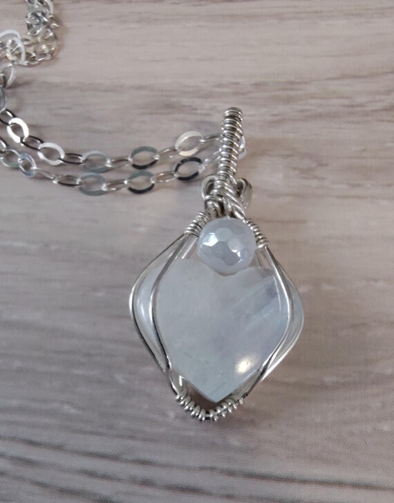 Moonstone Heart Artistically Wrapped in Sterling Silver