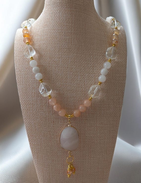 White Aventurine Pendant and Peach Toned Red Aventurine Gemstone Necklace With Large Irregular Cut Crystal Beads With Champagne Wash