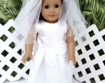 Wedding dress in polyester and lace.  Fits most 18 " dolls.