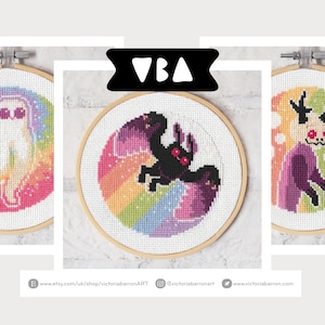May include: Three cross-stitch embroidery hoops with colorful designs. One features a white ghost against a rainbow background, another a black creature, and the third a purple figure. Each is in a wooden hoop. Text on the left says "PDF DIGITAL DOWNLOAD".