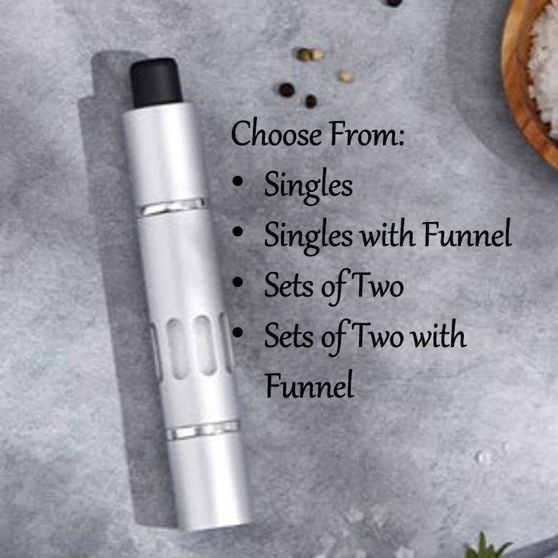 May include: A silver and black pepper grinder with a choice of options: singles, singles with funnel, sets of two, and sets of two with funnel.