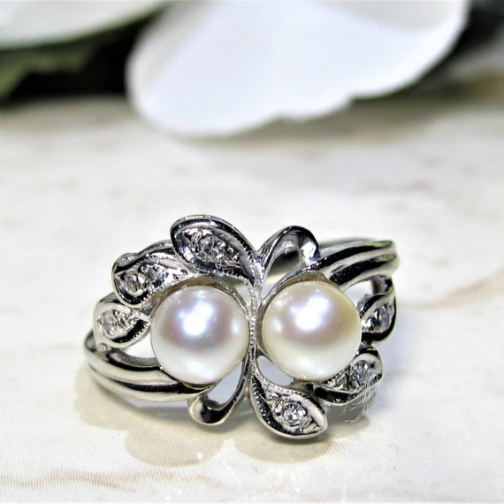 THE ANTIQUE PEARL AND DIAMOND TOI ET MOI RING