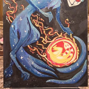 May include: An acrylic painting on canvas depicting a celestial figure in shades of blue, adorned with stars, reaching towards a fiery orb. The artwork features a dark background and is signed "KDE 2024".