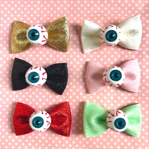 Super glittery eyeball hair bows in red gold black pink green or white