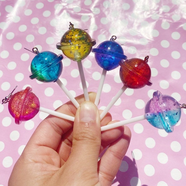 Kawaii glitter planet lollipop earrings in red pink purple orange yellow green and blue hook stud or clip on