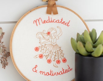 Medicated & Motivated: Finished embroidery hoop art and medication reminder. Mental health funny cross stitch completed and framed.