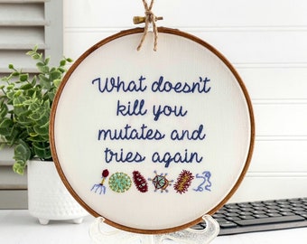 What doesn't kill you mutates and tries again: Framed Embroidery Art. Nerdy Cross Stitch Finished. Funny Science Gift for Her Microbiologist