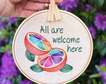 All Are Welcome Here: Subtle safe space sign for front door or inclusive classroom ally art. LGBTQIA pride finished embroidery hoop art.