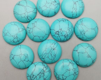May include: Twelve turquoise cabochons with a marbled pattern. The cabochons are round and have a smooth, polished surface.