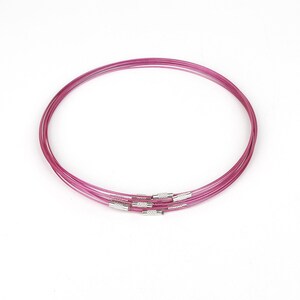 May include: Five pink metal choker necklaces with silver clasps.