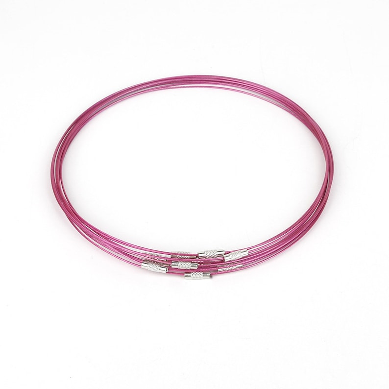 May include: Five pink metal choker necklaces with silver clasps.