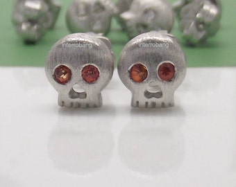 Stud earrings, skulls with fiery orange sapphire eyes, silver stud earrings, small stud earrings, skull stud earrings, skull earrings