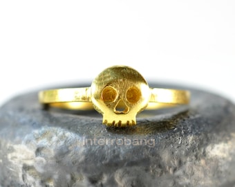 Miniature skull ring in butterscotch made from sterling silver and plated in yellow gold