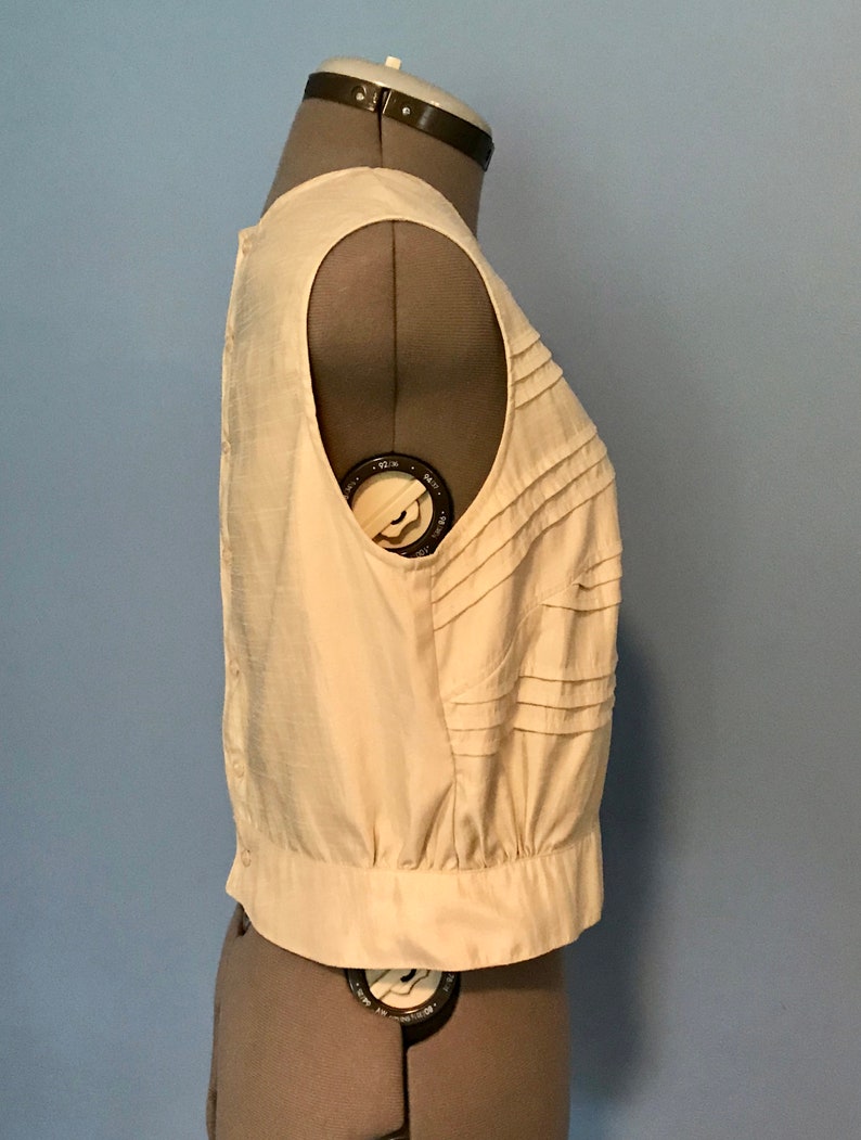 Ivory Pleated Silk Look Blouse with Floral Appliqu\u00e9