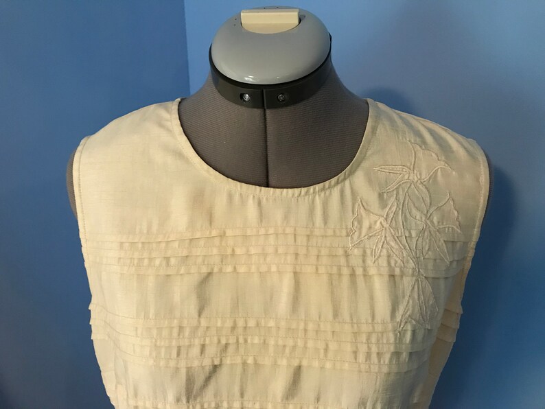 Ivory Pleated Silk Look Blouse with Floral Appliqu\u00e9