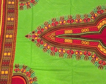 May include: Green fabric with a red, yellow, and black geometric pattern. The fabric has a traditional African design.