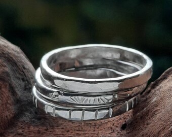 Handmade set of three silver  stacking rings, 'Freya, hammered and yew'