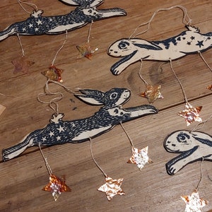 Handmade linocut print on wood rabbit hare decoration with copper stars