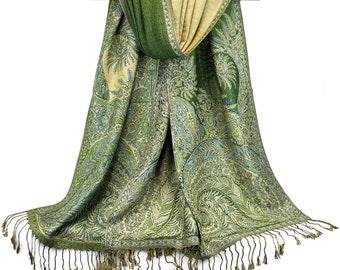 May include: A green and beige paisley patterned scarf with fringed edges. The scarf is draped over a silver rod.