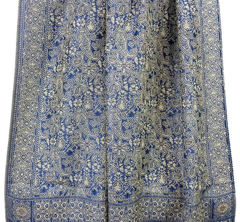 May include: A blue and white paisley patterned shawl with a fringed edge.