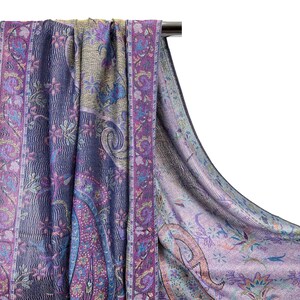May include: A purple and blue paisley patterned scarf with a fringed edge. The scarf is made of a soft, lightweight fabric and is perfect for adding a touch of elegance to any outfit.