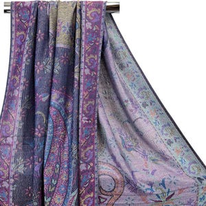 May include: A purple and blue paisley patterned shawl with a gold and pink border. The shawl is draped over a hanger.