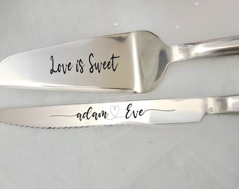 May include: A silver cake knife and server set with the words "Love is Sweet" engraved on the server and "adam ♥ Eve" engraved on the knife.