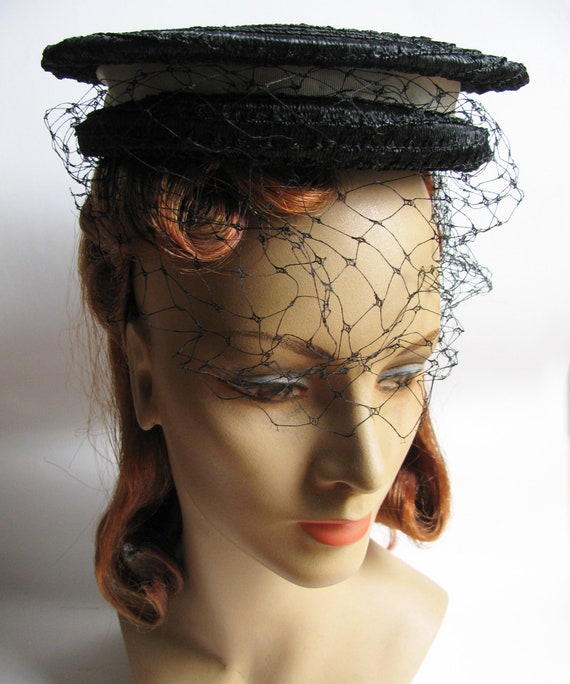 Woman"s Black Straw Sailor Hat adorned with White 