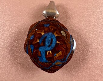 Pinecone and metallic blue inlay pendant
