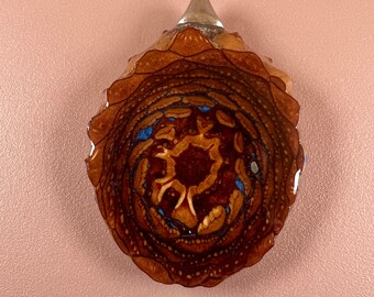 Pinecone pendant with metallic blue inlay