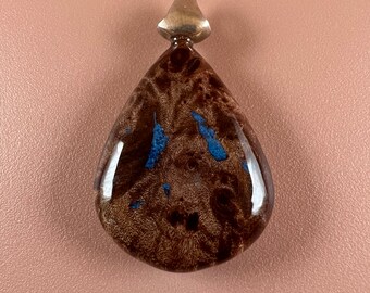 Burl wood pendant with metallic blue inlay