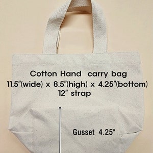 May include: A white cotton tote bag with a 12-inch strap. The bag measures 11.5 inches wide, 8.5 inches high, and has a 4.25-inch gusset.