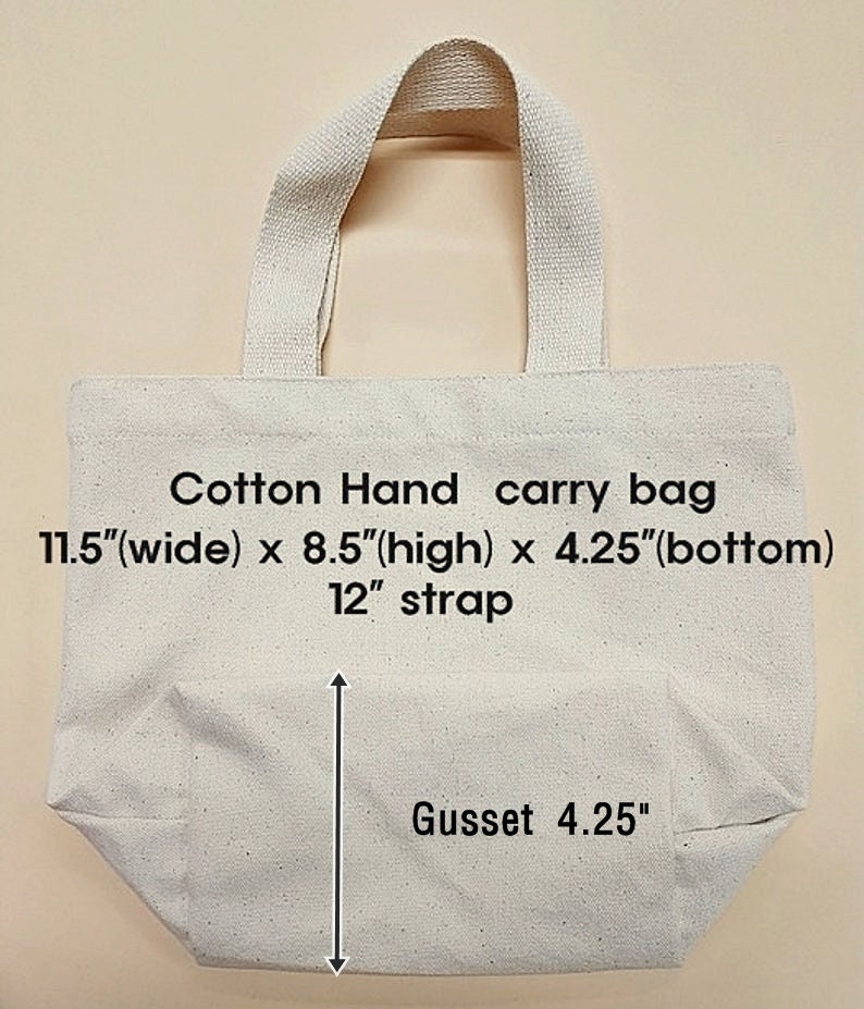 May include: A white cotton tote bag with a 12-inch strap. The bag measures 11.5 inches wide, 8.5 inches high, and has a 4.25-inch gusset.