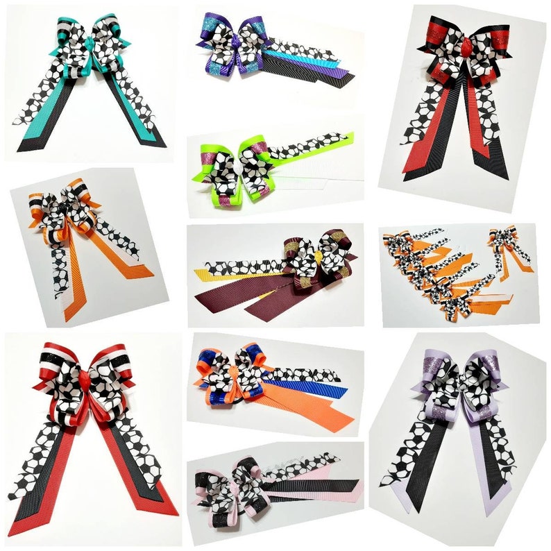 May include: A collection of handmade hair bows featuring a black and white soccer ball pattern. The bows are made with various colors of ribbon, including teal, purple, green, orange, red, black, and white.