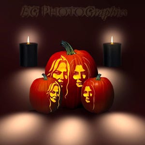 May include: Three orange pumpkins carved with detailed portraits of two women, illuminated from within to create a glowing effect. Two black pillar candles stand on either side of the pumpkins. The text EG PHOTOGRAPHICS appears at the top.