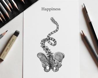 May include: A white rectangular print featuring a black and white graphite-style drawing of a human pelvis and a curved, elongated spine. The word Happiness is printed in a simple black serif font at the top centre of the white paper.