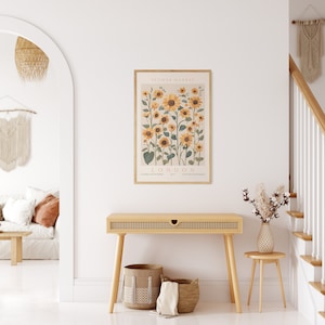 May include: A framed print of a botanical illustration of sunflowers with the text "FLOWER MARKET LONDON" and the names of different flower varieties.