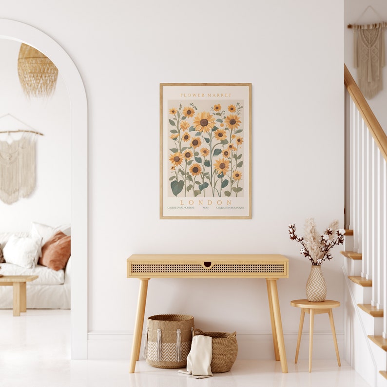 May include: A framed print of a botanical illustration of sunflowers with the text "FLOWER MARKET LONDON" and the names of different flower varieties.