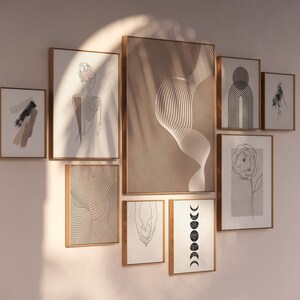 Puede incluir: Una pared de galer&iacute;a con nueve impresiones enmarcadas que presentan arte lineal abstracto y dise&ntilde;os minimalistas en negro, blanco y marr&oacute;n.