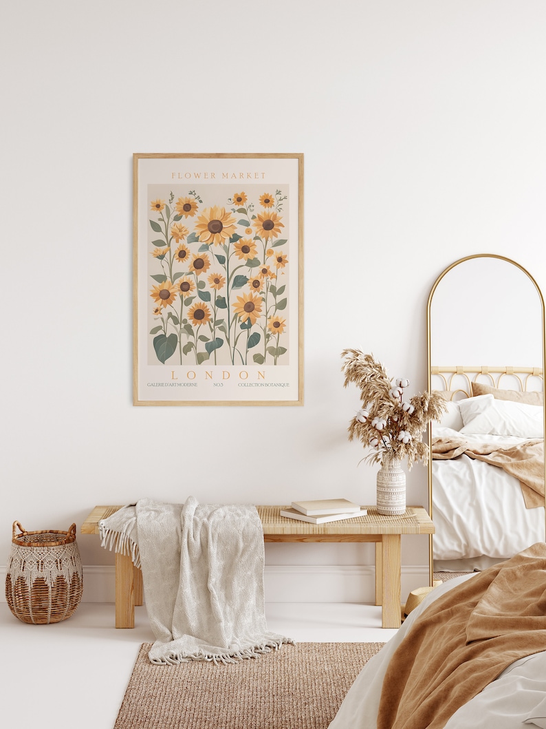 May include: A framed print with a botanical illustration of sunflowers. The print has the text "FLOWER MARKET LONDON" and "COLLECTION BOTANIQUE" at the bottom.