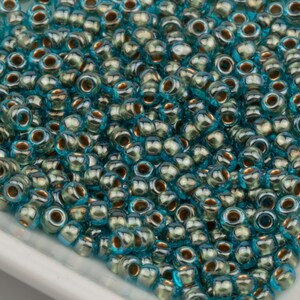 Toho Rocailles 8/0 Bronze Lined Aqua (#990) 15g 10642182