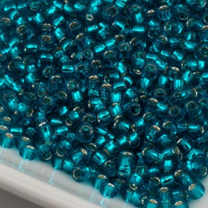 Toho Seed Beads 8/0 Light Green Aqua Silver Lined (#23BDA) 15g 10642127