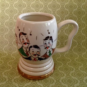 Vintage Barbership Quartet 10 oz Unique Mug faces of quartet on one side and HOW DRY I AM  along with musical notes on the other side.