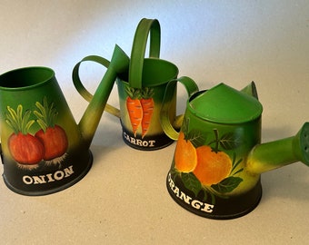 Set of three small watering cans with hand painted images featuring onions, carrots and oranges - for display or use - price includes all