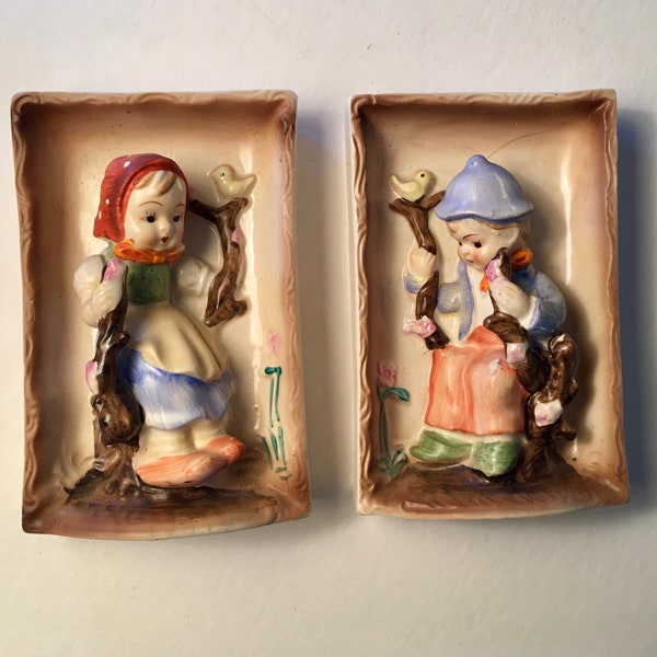 LAST CHANCE! Pair of vintage 3-d small wall plaques featuring a Dutch girl and boy by Enesco Imports made in Japan