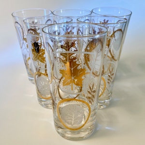 Set of six vintage glass tumblers with various tree leaves in gold or white